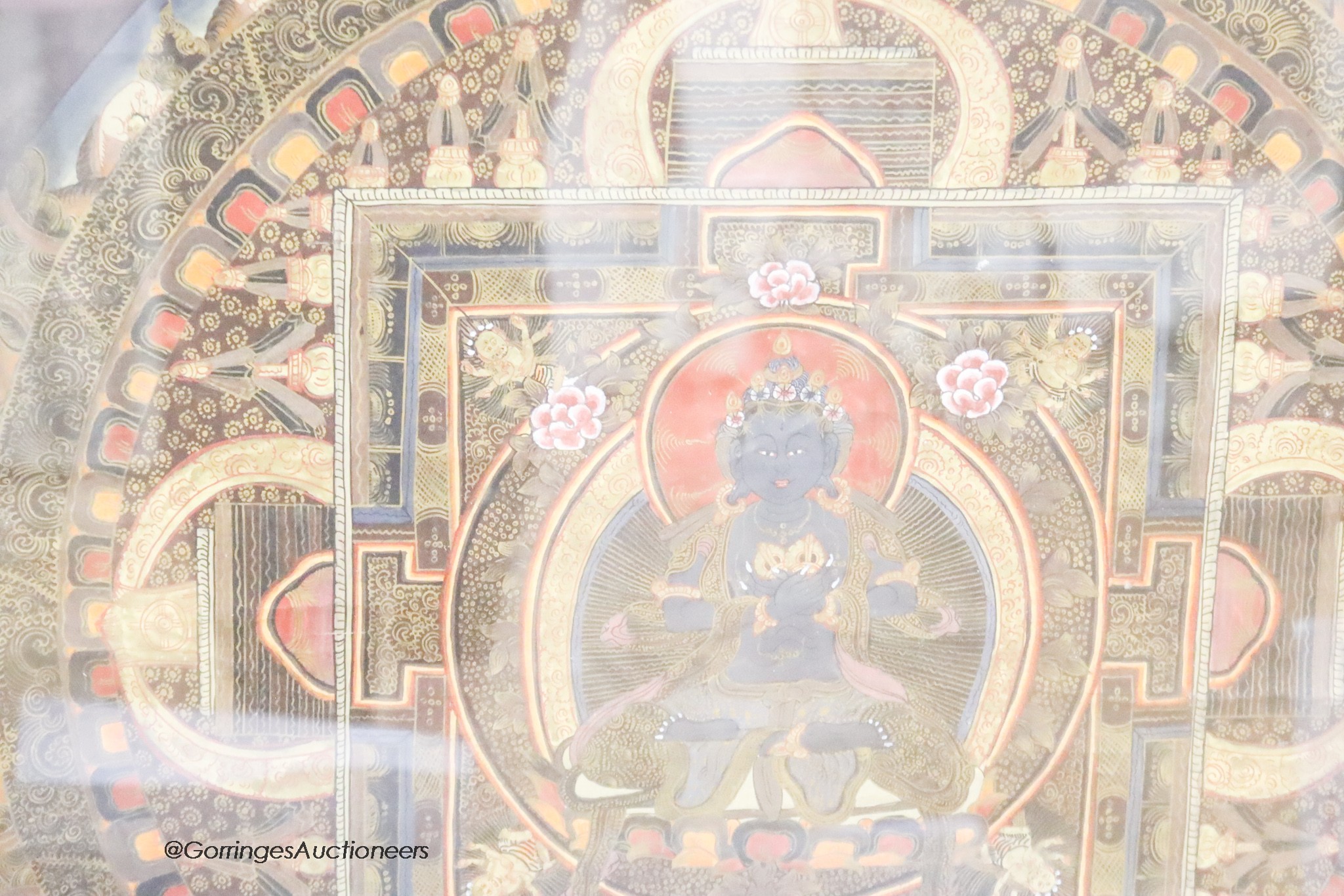 A framed and glazed Tibetan Mandala thangka, 71 x 51cm